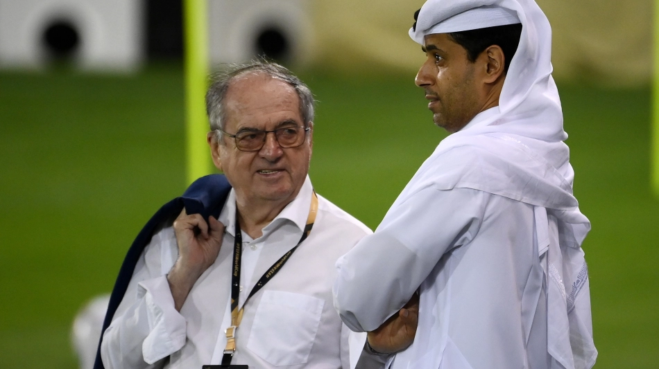 Noel Le Graet speaks with PSG chief Nasser Al Khelaifi in Doha on November 17: AFP/Franck Fife