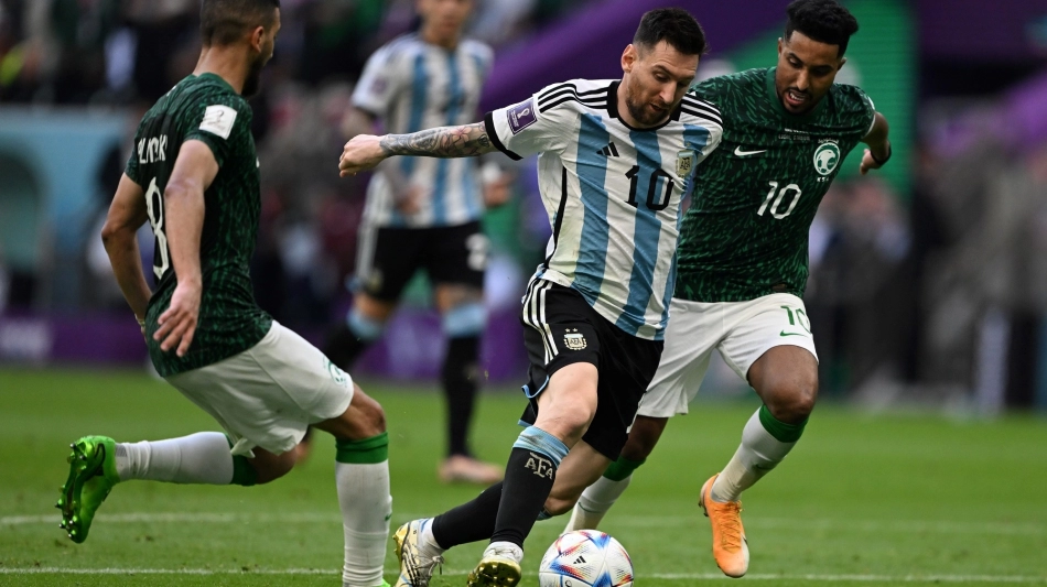 Argentina’s Lionel Messi fights for the ball with Saudi Arabia’s Salem Al Dawsari, right: AFP/Kirill Kudryavtsev