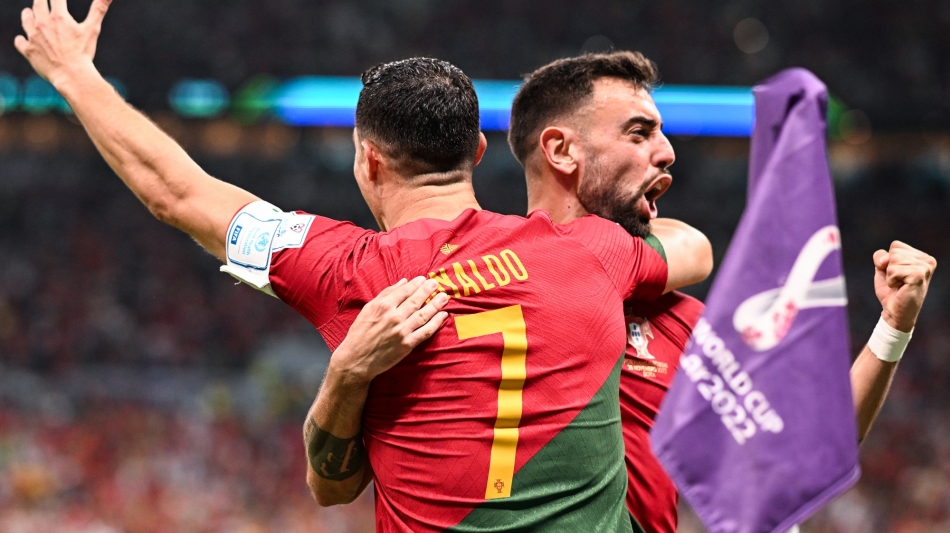 Bruno Fernandes and Cristiano Ronaldo celebrate Portugal’s first goal against Uruguay: AFP/Kirill Kudryavtsev