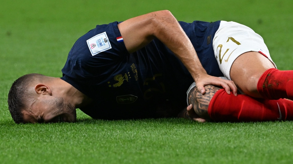 Lucas Hernandez reacts after he sustained an injury during the match against Australia: AFP/Chandan Khanna