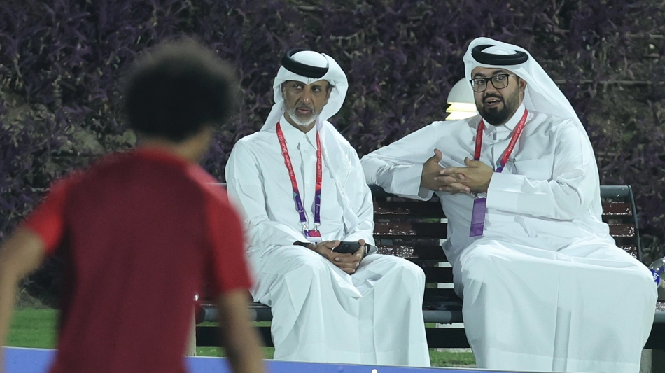 Qatar Football Association President HE Sheikh Hamad bin Khalifa bin Ahmed Al Thani, left, and Qatar national team manager Talal Al Kaabi attend a training session in Doha on November 16: AFP/Karim Jaafar