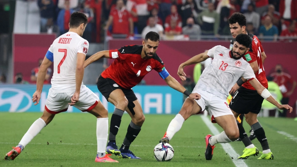 Tunisia’s Yousef Msakni and Ferjani Sassi vie for the ball with Egypt’s Amr El Solia during the FIFA Arab Cup 2021 semifinal at the 974 Stadium in Doha on December 15, 2021: AFP/Karim Sahib