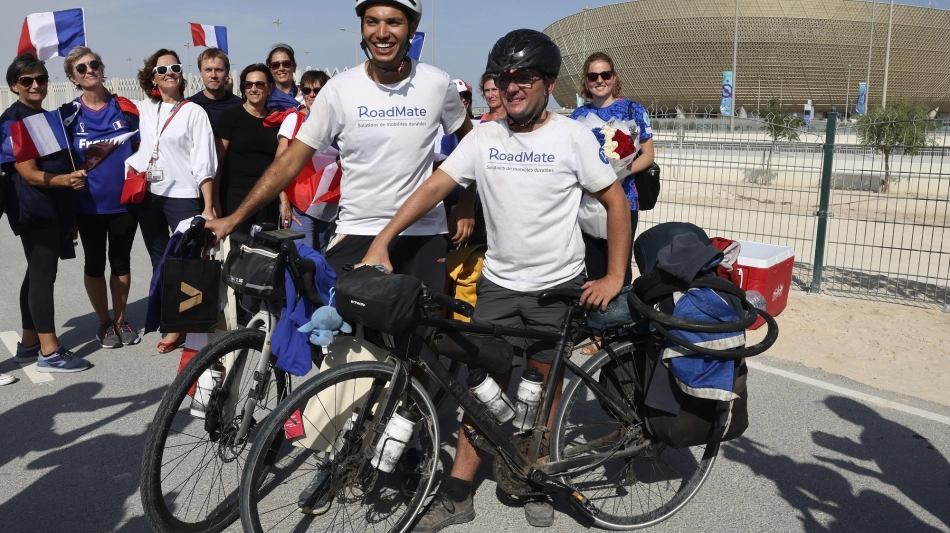 Gabriel Martin, right, and Mehdi Balamissa pose for pictures upon their arrival in Doha: AFP/Jack Guez