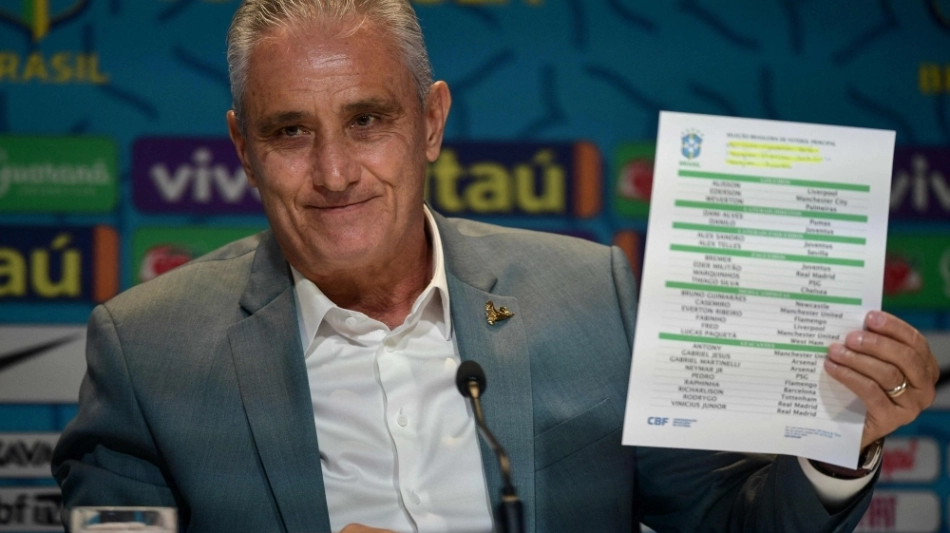 Brazil's coach Tite shows the list of players for the upcoming Qatar 2022 World Cup football tournament, at the Brazilian Football Confederation (CBF) headquarters in Rio de Janeiro, Brazil, on November 7, 2022. (Photo by Carl DE SOUZA / AFP)