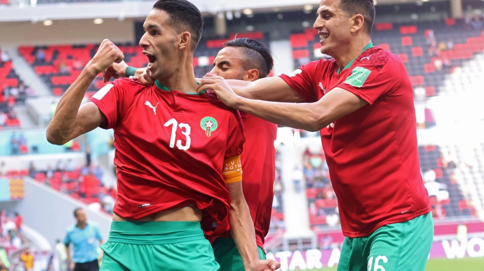 Morocco's Badr Benoun, left, celebrates with team-mates after scoring against Jordam at the 2021 FIFA Arab Cup in Doha. AFP: Karim Sahib
