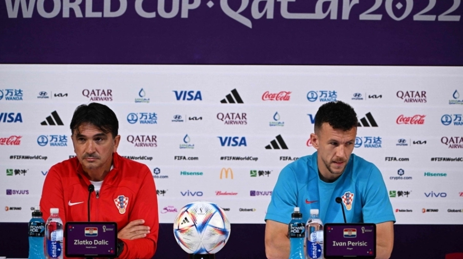 Croatia's coach Zlatko Dalic (left) and midfielder Ivan Perisic attend a press conference at the Qatar National Convention Center (QNCC) in Doha on November 26, 2022. (Photo by OZAN KOSE / AFP)