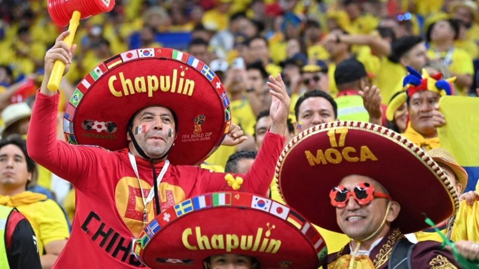 Mexican supporters cheer ahead of the Qatar 2022 World Cup Group A football match between Qatar and Ecuador at the Al-Bayt Stadium in Al Khor, north of Doha on November 20, 2022. (Photo by Glyn KIRK /AFP)
