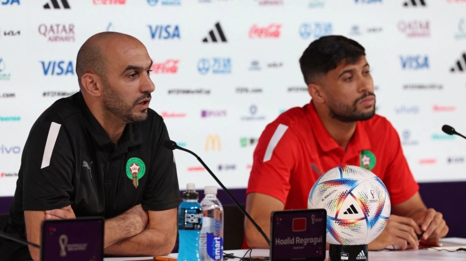 Morocco's coach Hoalid Regragui (left) and midfielder Yahya Jabrane attend a press conference at the Qatar National Convention Center (QNCC) in Doha on November 26, 2022. (Photo by Fadel Senna / AFP)