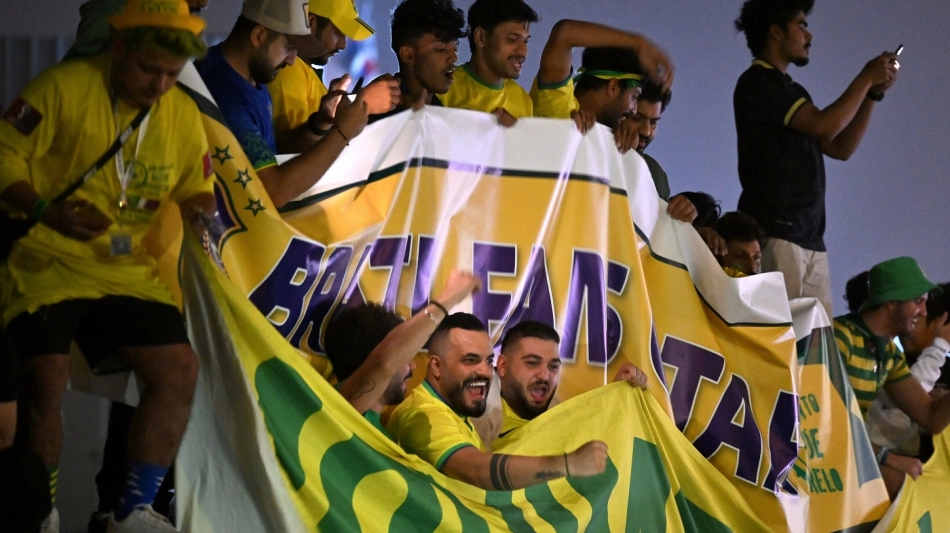 Brazil fans gather outside the Westin Doha Hotel & Spa to welcome the players: AFP/Nelson Almeida