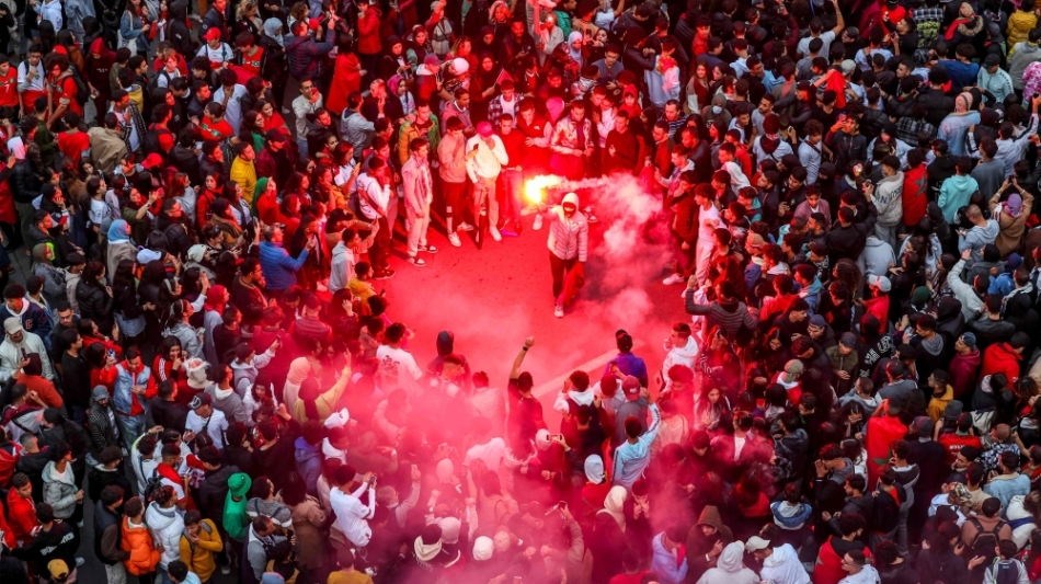 Morocco's supporters celebrate after their country's win of the Qatar 2022 World Cup match against Portugal, in Rabat, on December 10, 2022. (Photo by FADEL SENNA / AFP)