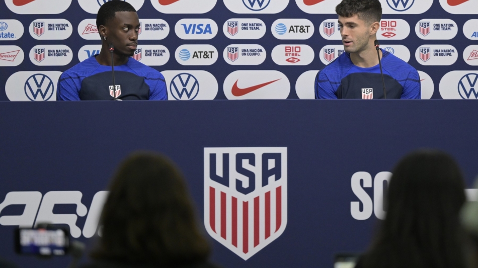 USA's forward Christian Pulisic (right) and USA's forward Timothy Weah give a press conference at Al Gharafa SC Stadium in Doha on December 1, 2022. (Photo by JUAN MABROMATA / AFP)