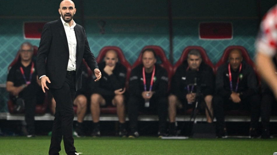 Morocco's coach Walid Regragui watches from the touch line during the Qatar 2022 World Cup third place play-off match against Croatia at Khalifa International Stadium in Doha on December 17, 2022. (Photo by Paul ELLIS / AFP)