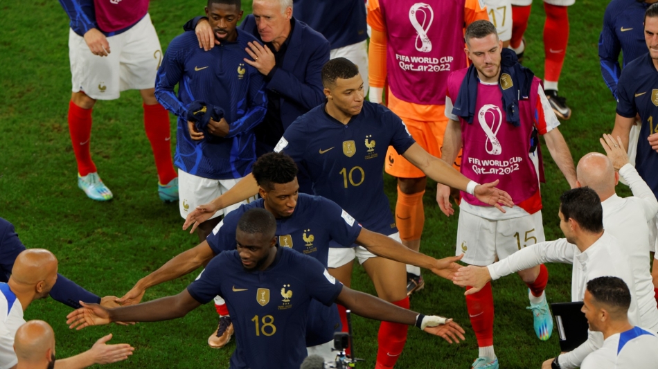 France and Bayern Munich player Kingsley celebrate with teammates at the end of the Qatar 2022 World Cup round of 16 match against Poland at the Al-Thumama Stadium in Doha on December 4, 2022. (Photo by Odd ANDERSEN / AFP)