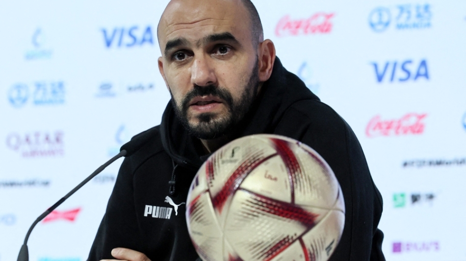 Morocco's coach Walid Regragui speaks during a press conference in Doha on December 13, 2022. (Photo by KARIM JAAFAR / AFP)