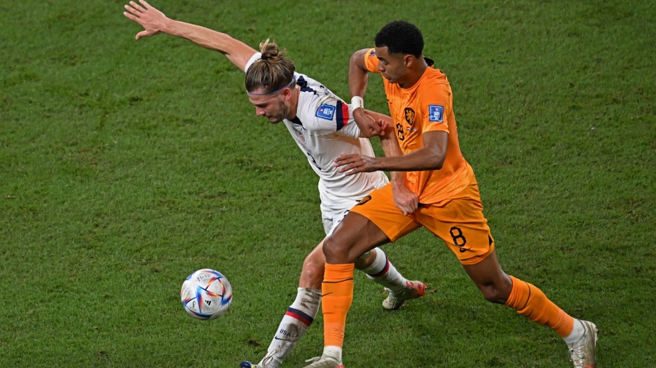 USA’s Walker Zimmerman, left, being challenged by the Netherlands’ Cody Gakpo: AFP/Raul Arboleda
