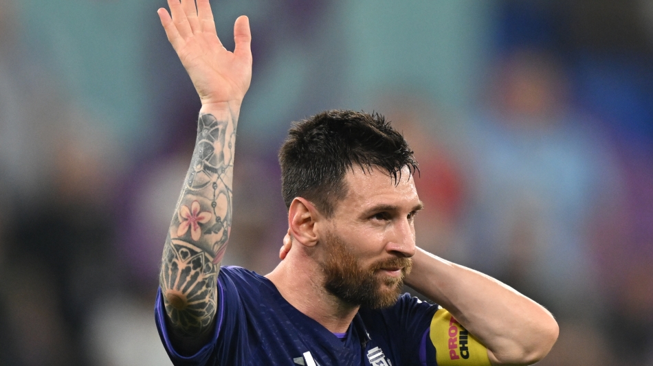 Argentina’s Lionel Messi waves to supporters after their win over Poland: AFP/Andrej Isakovic
