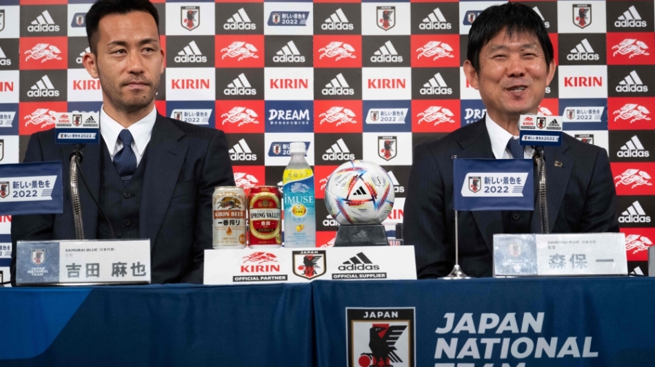 Japan's coach Hajime Moriyasu(right) and Maya Yoshida attends a press conference in Narita, Chiba prefecture in Narita on December 7, 2022. (Photo by Yuichi YAMAZAKI / AFP