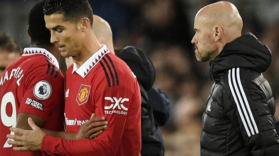 Manchester United’s Dutch manager Erik ten Hag watches as Cristiano Ronaldo is subbed on for Anthony Martial, left: AFP/Oli Scarff