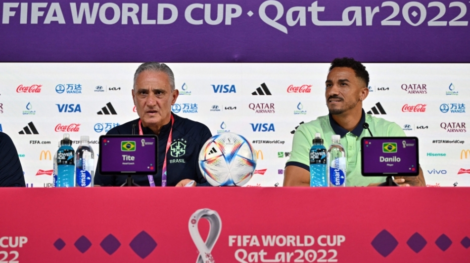 Brazil's coach Tite (left) and defender Danilo give a press conference at the Qatar National Convention Center (QNCC) in Doha on December 8, 2022. (Photo by NELSON ALMEIDA / AFP)