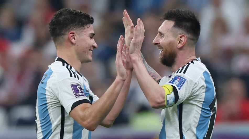 Argentina’s Julian Alvarez, left, and Lionel Messi in a joyous mood against Croatia: AFP/Giuseppe Cacace