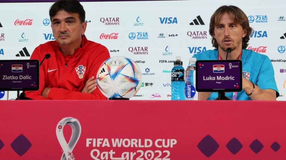 Croatia's coach Zlatko Dalic (left) and midfielder Luka Modric hold a press conference at the Qatar National Convention Center (QNCC) in Doha on December 8, 2022. (Photo by JACK GUEZ / AFP)