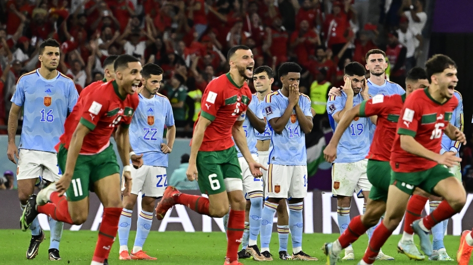 Morocco players celebrate winning the penalty shootout against Spain: AFP/Javier Soriano
