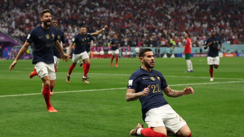 France's defender Theo Hernandez celebrates after scoring his team's first goal during the Qatar 2022 World Cup semi-final match against Morocco at the Al-Bayt Stadium in Al Khor on December 14, 2022. (Photo by Adrian DENNIS / AFP)