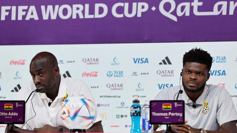 Ghana's coach Otto Addo (left) and midfielder Thomas Partey give a press conference at the Qatar National Convention Center (QNCC) in Doha on December 1, 2022. (Photo by Khaled DESOUKI / AFP)