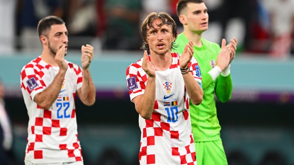 Luka Modric, centre, with team-mates: AFP