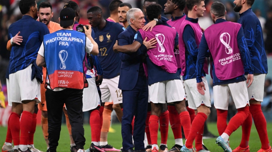 France's coach Didier Deschamps congratulates his players after the Qatar 2022 World Cup semi-final match against Morocco at the Al-Bayt Stadium in Al Khor, north of Doha on December 14, 2022. (Photo by Kirill KUDRYAVTSEV / AFP)