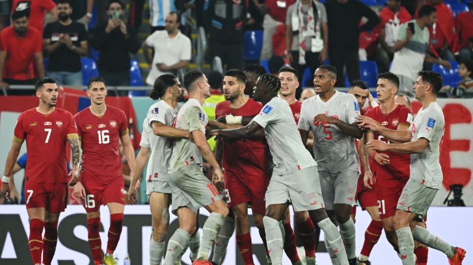 Switzerland's midfielder Granit Xhaka (center left) and Serbia's players scuffle during the Qatar 2022 World Cup Group G match at Stadium 974 in Doha on December 2, 2022. (Photo by Ina Fassbender / AFP)