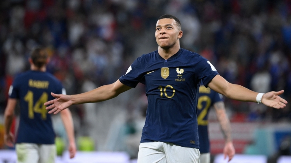 France's forward Kylian Mbappe celebrates scoring his team's third goal during the Qatar 2022 World Cup round of 16 match against Poland at the Al-Thumama Stadium in Doha on December 4, 2022. (Photo by FRANCK FIFE / AFP)
