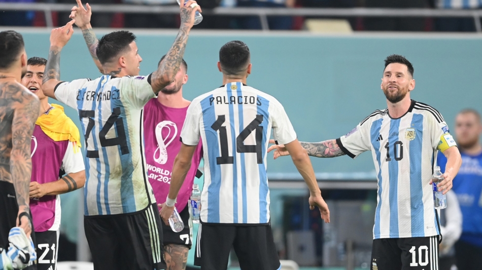 Argentina's forward Lionel Messi (right) celebrate with teammates after they won the Qatar 2022 World Cup round of 16 match against Australia at the Ahmad Bin Ali Stadium in Al-Rayyan on December 3, 2022. (Photo by FRANCK FIFE / AFP)