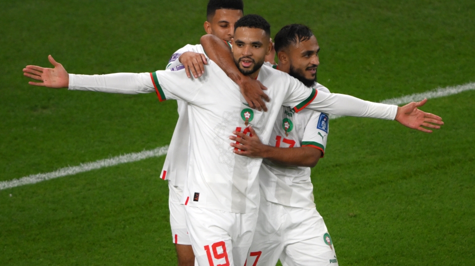 Moroccon players celebrate a goal against Canada: AFP/Paul Ellis
