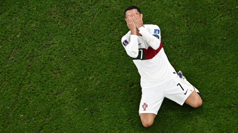 Portugal's Cristiano Ronaldo reacts during the Qatar 2022 World Cup quarter-final match against Morocco at the Al-Thumama Stadium in Doha on December 10, 2022. (Photo by MANAN VATSYAYANA / AFP)