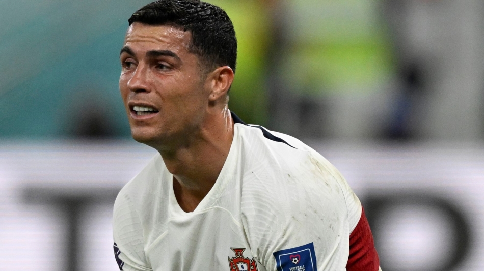 Portugal's forward Cristiano Ronaldo reacts after his team lost the Qatar 2022 World Cup quarter-final match against Morocco at the Al-Thumama Stadium in Doha on December 10, 2022. (Photo by PATRICIA DE MELO MOREIRA / AFP)