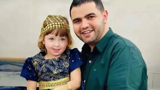 الطفلة ملاك مع والدها محمد هنية الذي استشهد في أول أيام عيد الفطر